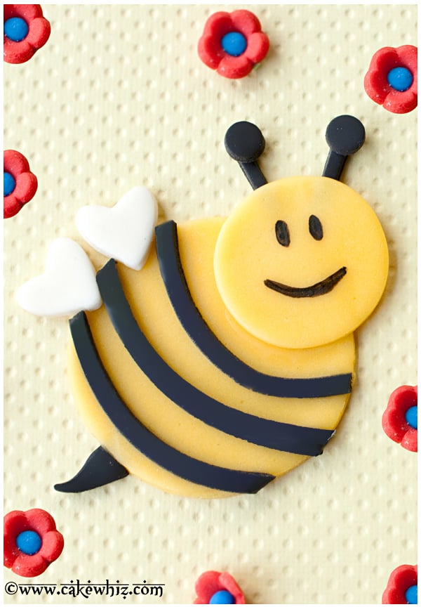 Fondant Bumblebee Cupcake Topper on Yellow Background