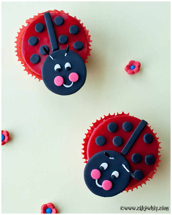 2 Ladybug Cupcakes on Yellow Background