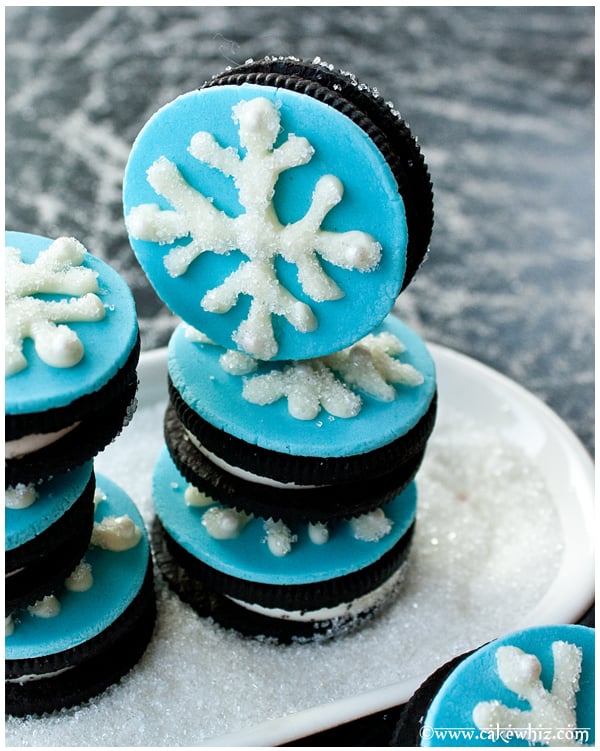 Stack of Easy Snowflake Cookies in White Dish With Sparkling Sugar