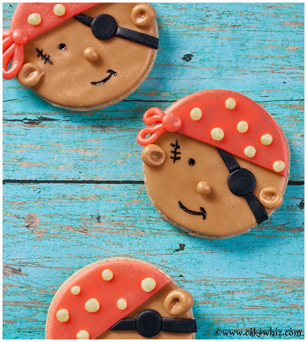 Easy Pirate Cookies Decorated With Fondant on Rustic Blue Background.