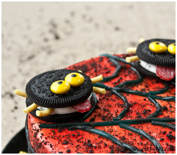 Closeup Shot of Oreo Spider on Top of Red Fondant