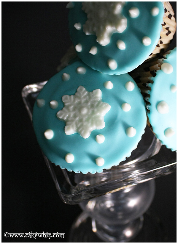 Homemade Winter Cupcakes Stacked on Top of One Another on Glass Stand
