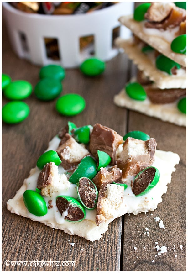 Partially Eaten Sweet and Salty Cracker for St.Patrick's Day on Brown Wood Background