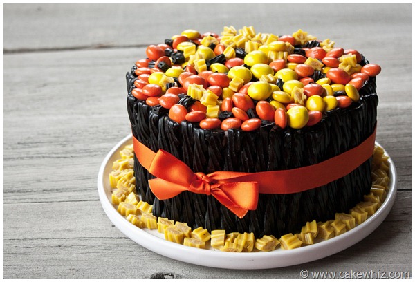 Homemade Halloween Twizzler Cake on White Dish With Rustic Gray Background