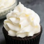 Easy Marshmallow Frosting With Marshmallow Fluff Piped on Top of Chocolate Cupcake.