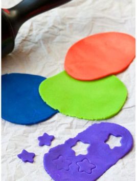 Easy Homemade Marshmallow Fondant in Different Colors on Dull Gray Background