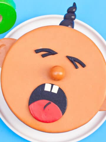 Easy Baby Cake With Homemade Fondant Decoration on White Dish.