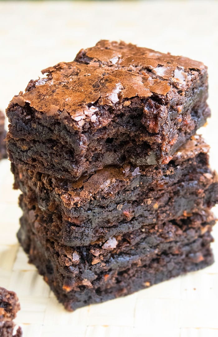 Stack of Easy Carrot Brownies on Wood Background. 