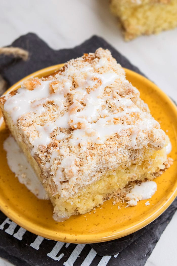 Cake Slice With Glaze on Yellow Dish. 