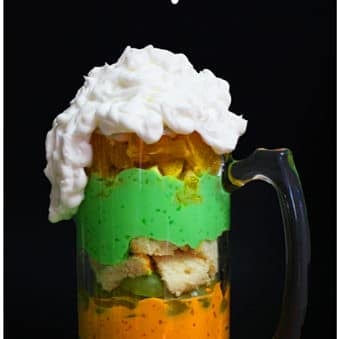 Irish Trifle in Glass Beer Mug With Black Background.