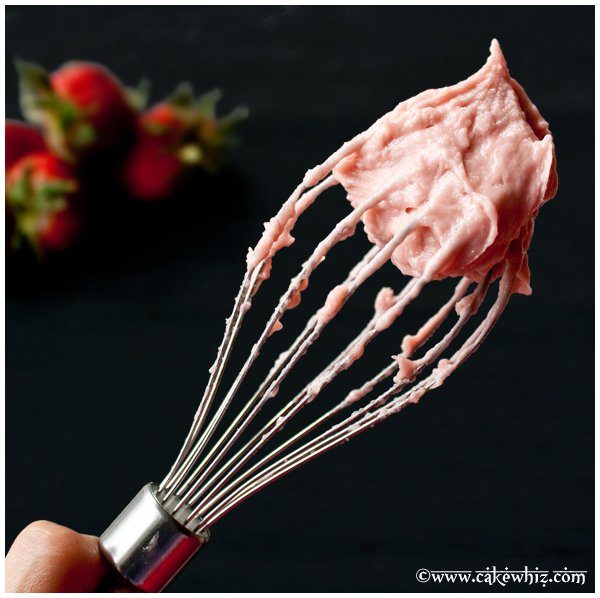 Fresh Strawberry Frosting on a Whisk  With Black Background