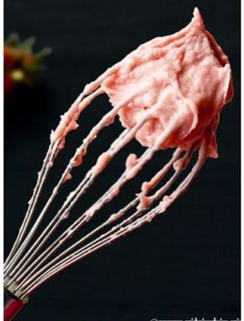Easy Strawberry Frosting With Fresh Strawberries on Whisk With Black Background