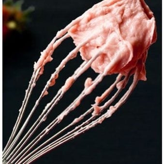 Easy Strawberry Frosting With Fresh Strawberries on Whisk With Black Background