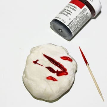 Toothpick being used to add red tint to white mmf. 