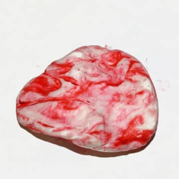 Marbled fondant on white background. 