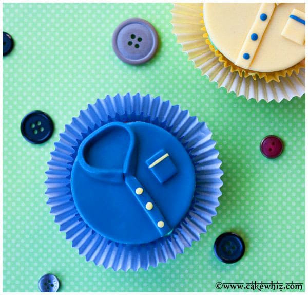 Homemade Father's Day Cupcakes With Fondant Shirt Topper on Green Background