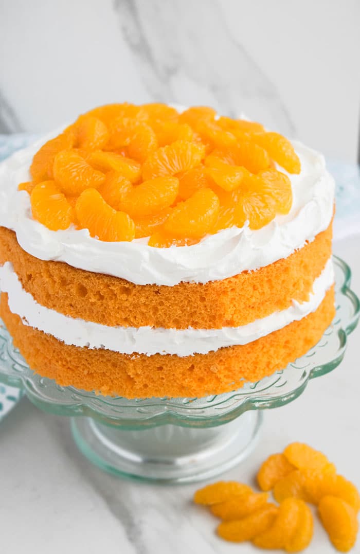 Orange Layer Cake on Glass Cake Stand