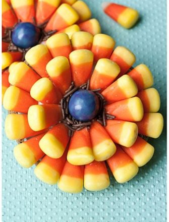 Easy Homemade Leftover Halloween Candy Cookies With Candy Corns on Pastel Blue Background