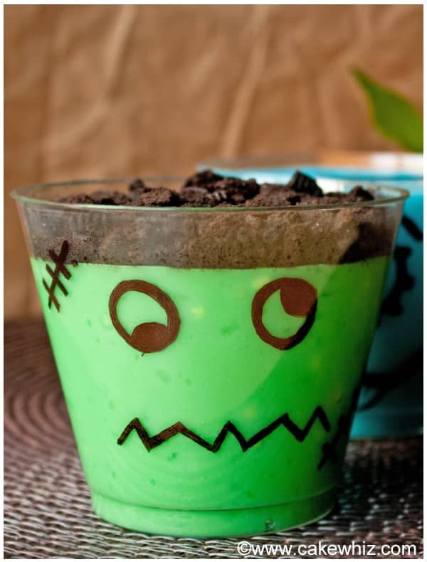 Frankenstein Pudding Cups on Brown Background