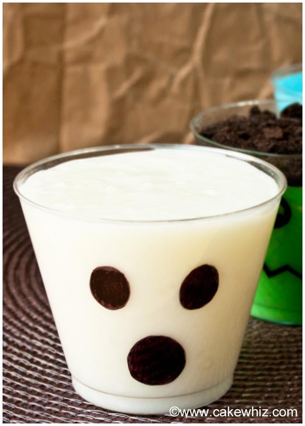 Ghost Pudding Cups on Brown Background