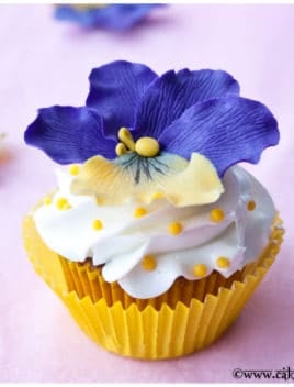 Easy Homemade Fondant Flower Cupcakes with Yellow Liner and Pink Background