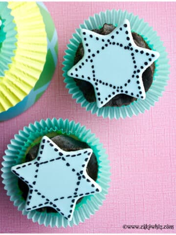 Star of David Cupcakes on Pink Background.