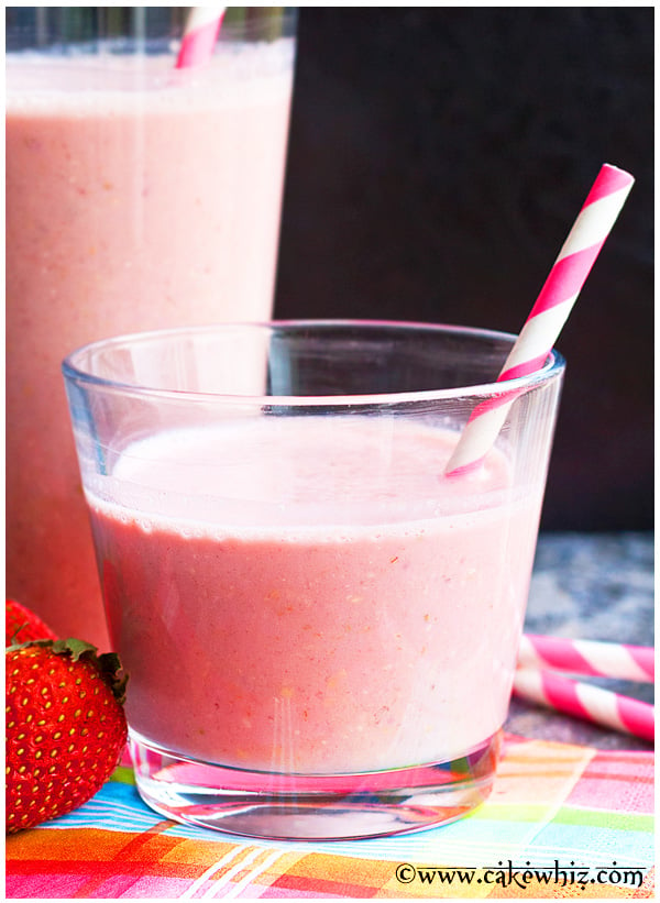 Easy Homemade Strawberry Smoothie in a Clear Glass with Straw