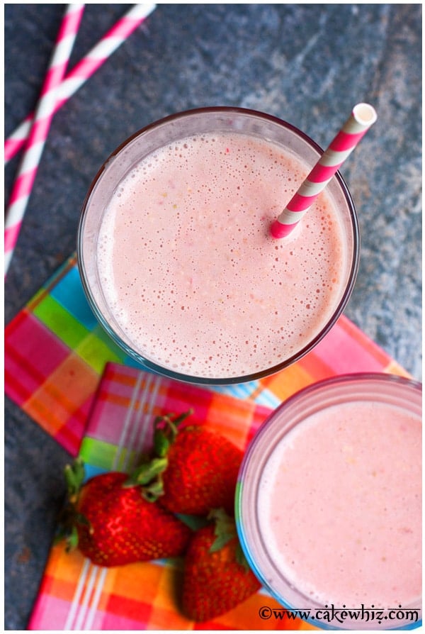 Overhead Shot of Two Glasses of Pink Strawberry Smoothies