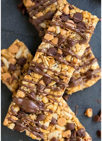 Best Easy Homemade Granola Bars With Peanut Butter and Chocolate Chips on Black Stone Background.