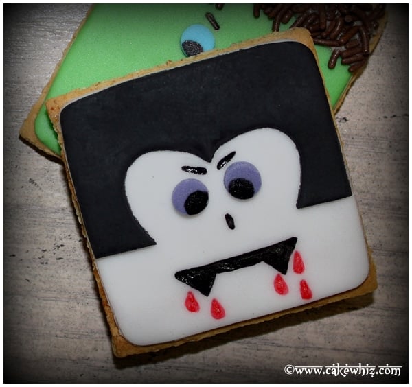 Easy Homemade Dracula or Vampire Cookies (Halloween Cookies) on Rustic Gray Background