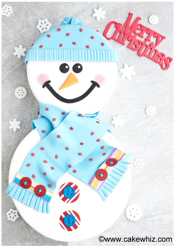 Christmas Snowman Cake With Face and Body on Gray Background