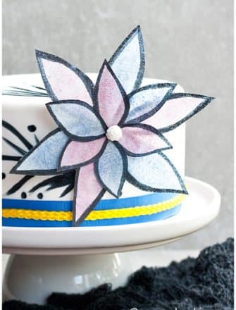 Edible Easy Wafer Paper Flowers on White Fondant Cake With Gray Background