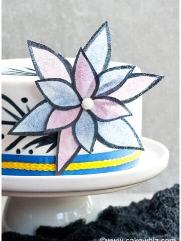 Edible Easy Wafer Paper Flowers on White Fondant Cake With Gray Background