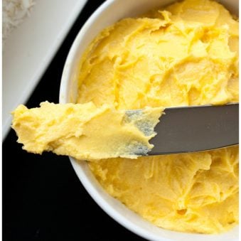 Easy Mango Frosting in White Bowl and Black Background.
