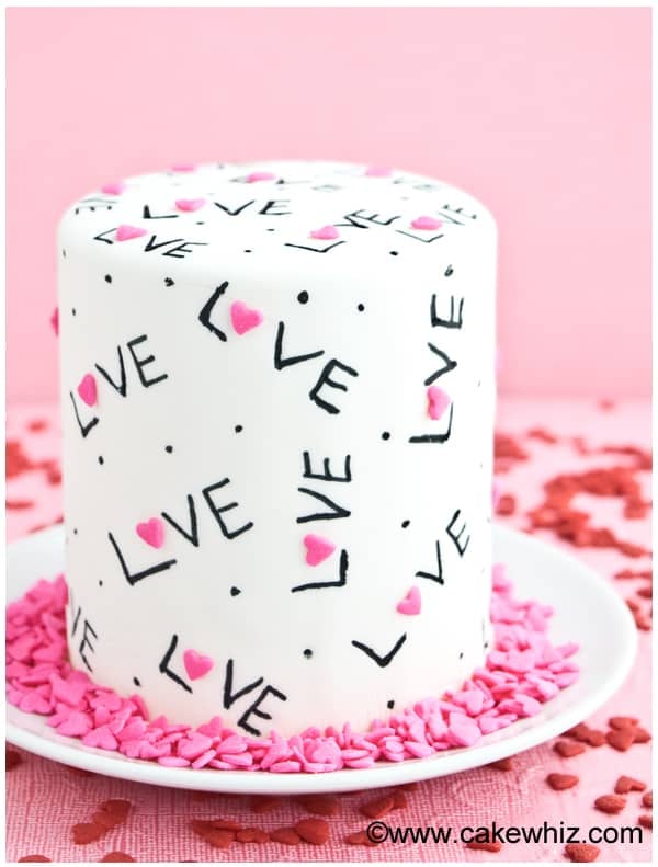 Easy Decorated Love Cake Design on White Plate with Pink Background