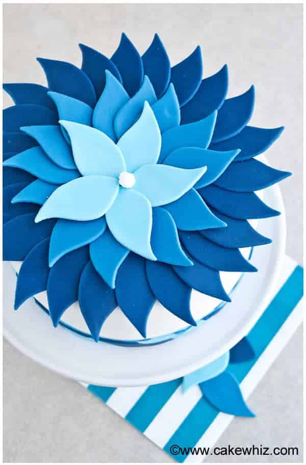 Easy Ombre Cake Decorated With Blue Fondant on Light Gray Background