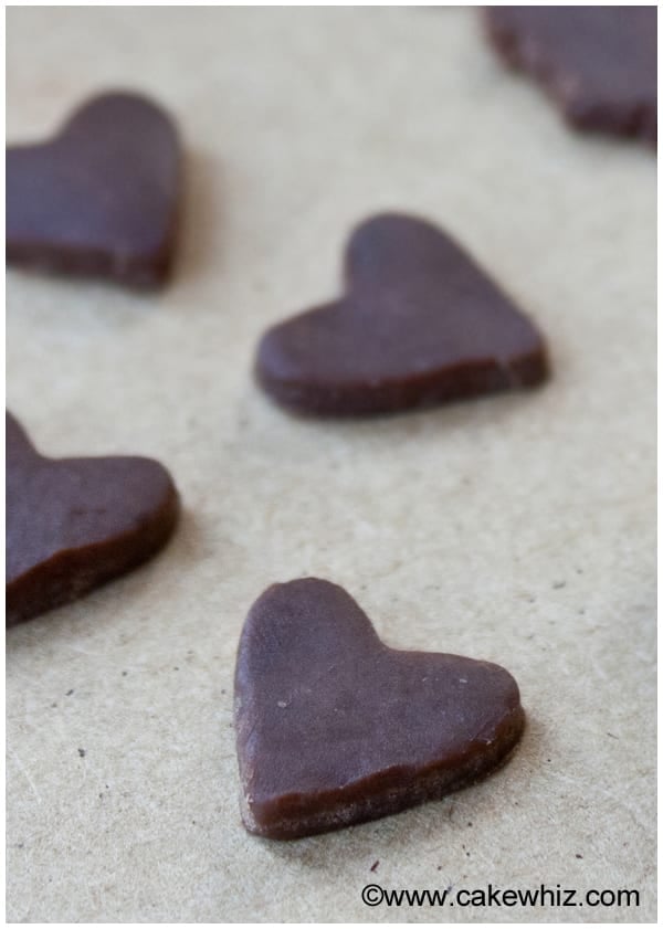 Homemade Candy Clay Hearts on Wood Background