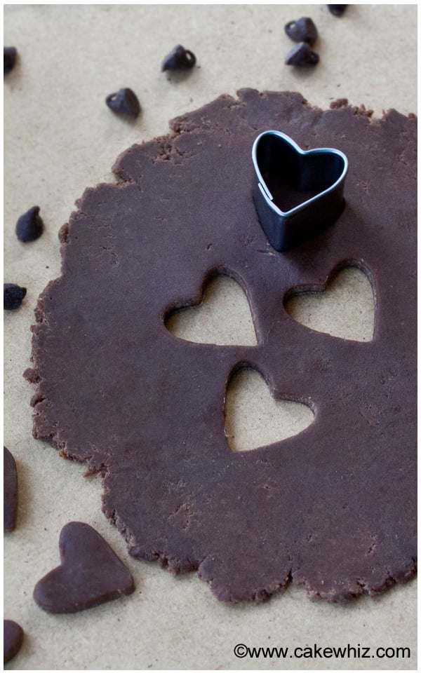 Easy Modeling Chocolate Rolled Out on Table With Heart Cut Outs 