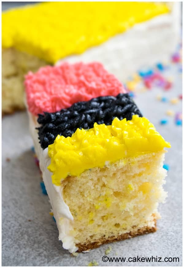 Slice of Pound Cake With Frosting on Gray Background