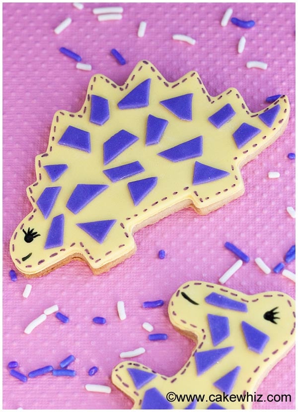 Homemade Dino Cookies Decorated With Fondant on Pink Background