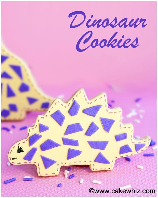 Easy Homemade Decorated Dinosaur Biscuits on Pink Background