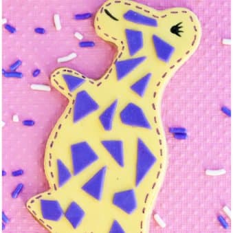Easy Dinosaur Cookies Decorated with Fondant on Pink Background