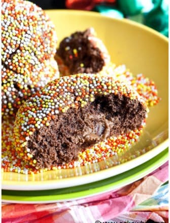 Easy Stuffed Chocolate Rolo Cookies on Yellow Plate-Partially Eaten