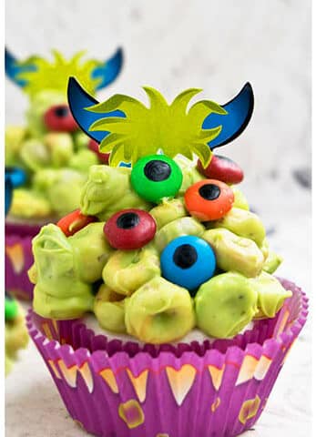Easy Homemade Halloween Monster Cupcakes on Rustic Background