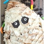 Easy Homemade Halloween Mummy Cake on Rustic Background
