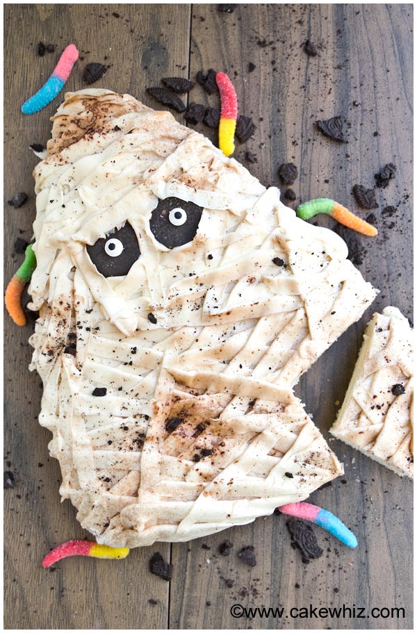 Partially Sliced Halloween Cake in Shape of Mummy 