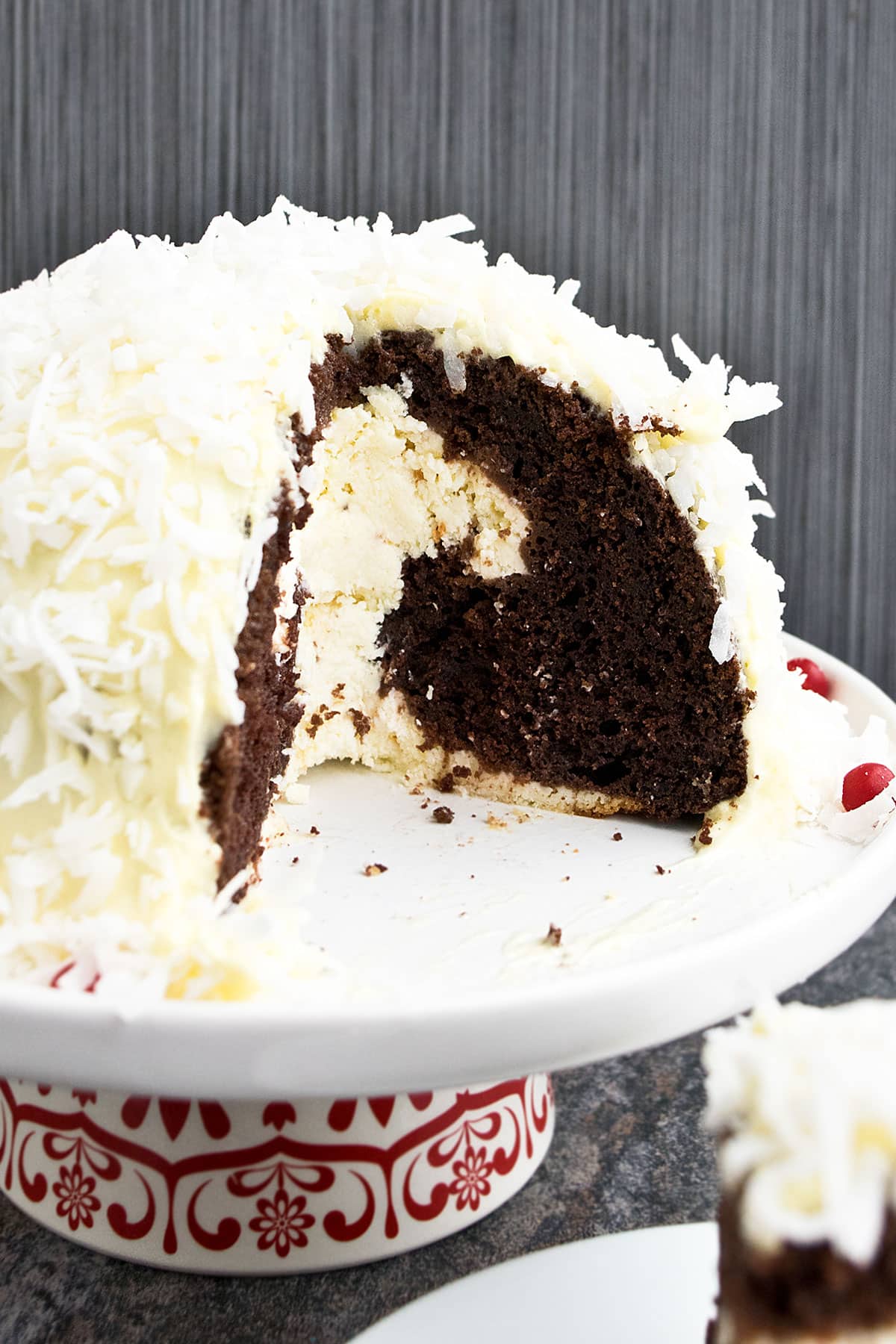 Dome cake with one sliced removed. 