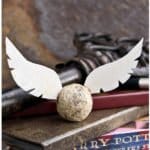 Edible DIY Harry Potter Golden Snitch Truffles on Stack of Books