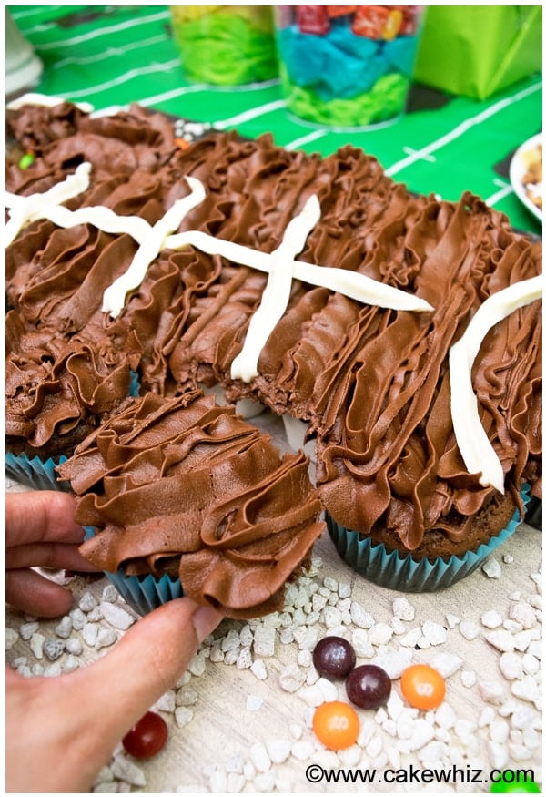 Pulling Apart One Cupcake From Football Cake