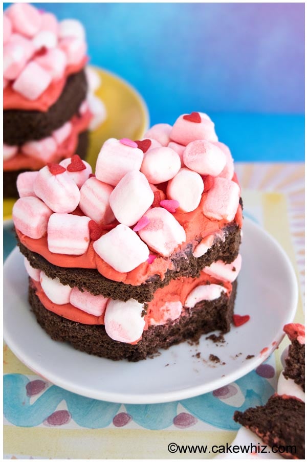 Mini Heart Cake With Strawberry Frosting and Pink Marshmallows on White Plate 